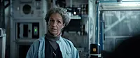 Амира Хазалла — роль Dr. Lokken в фильме «Проект «Конец света»», кадр #1